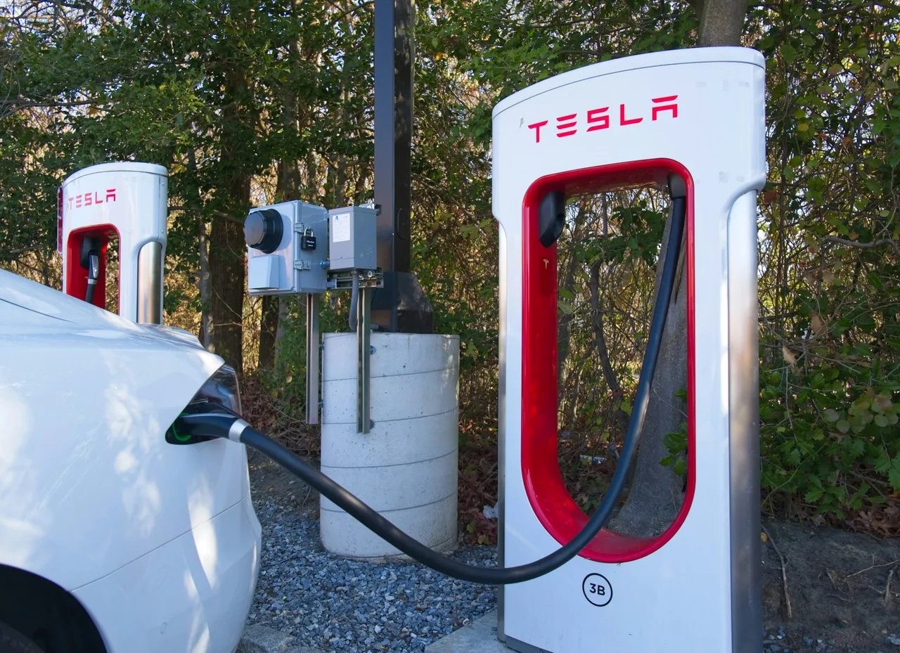 Modern EV charging point at home driveway